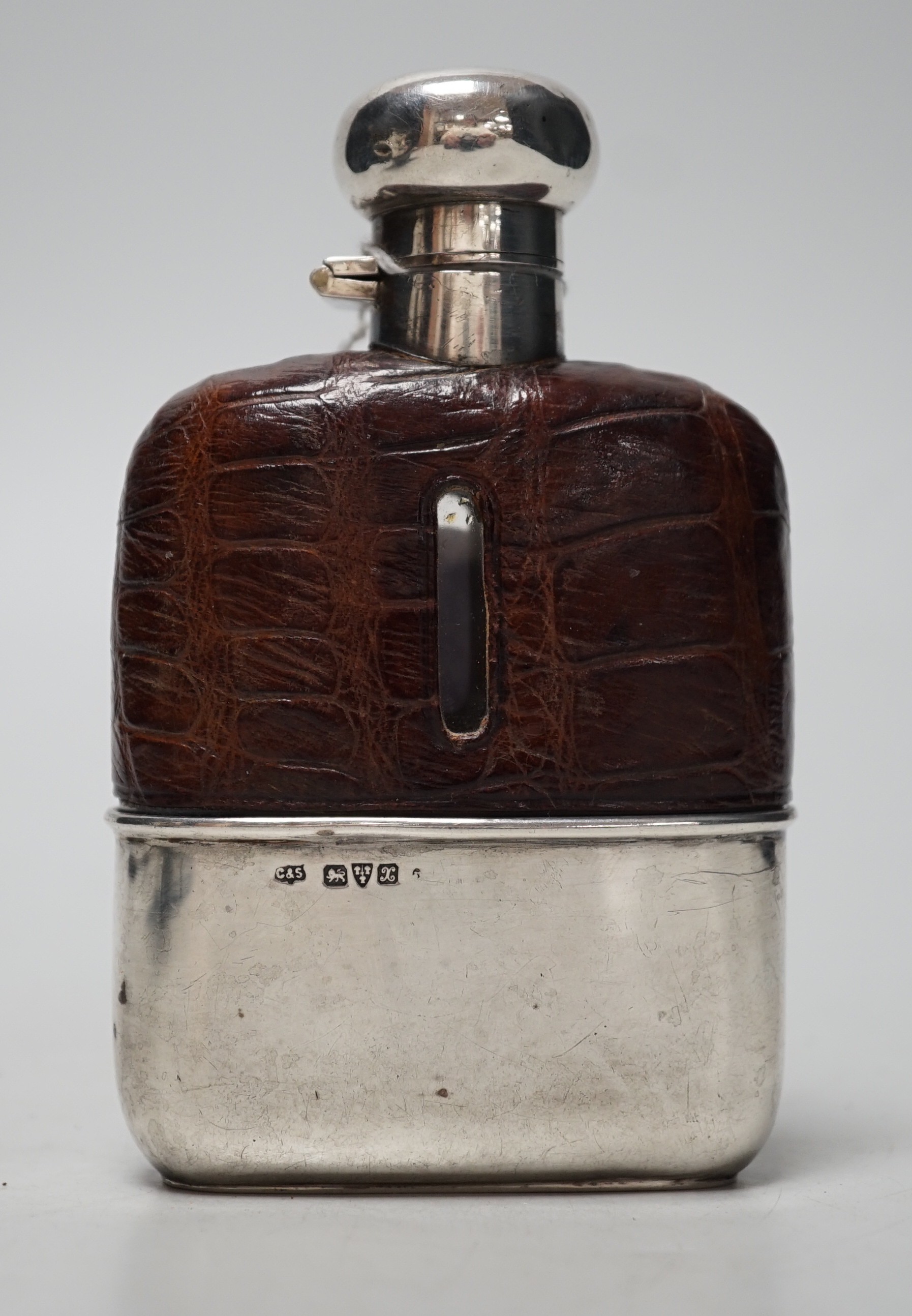 A George V silver and crocodile skin mounted glass hip flask, Chester, 1923, 11.6cm.
